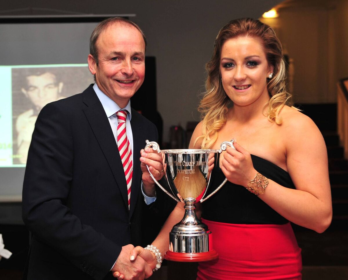 'Champion of Champions' and Youth Olympian, Macrooms Christina Desmond, receiving her award the Paddy 'The Champ' Martin Cup from Fianna Fail leader Micheal Martin. The perpetual cup was presented by the Martin family in honour of their late father, the legendary Cork boxer Paddy Martin more fondly remembered as 'The Champ'.