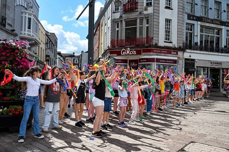 St Patricks Street was a riot of colour on Tuesday as Students of Educate Together NS exploded onto the street for an energetic flashmob in aid of My Canine Companion. Picture Credit: Chani Anderson