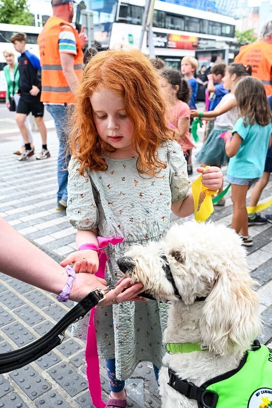 'Treats Please!' - Rua Scannell from Educate Together NS Junior Infants pictured with Eugene the dog. Picture Credit: Chani Anderson