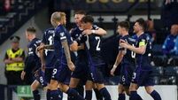 Scotland beat Georgia – and the weather – to move eight points clear in Group A