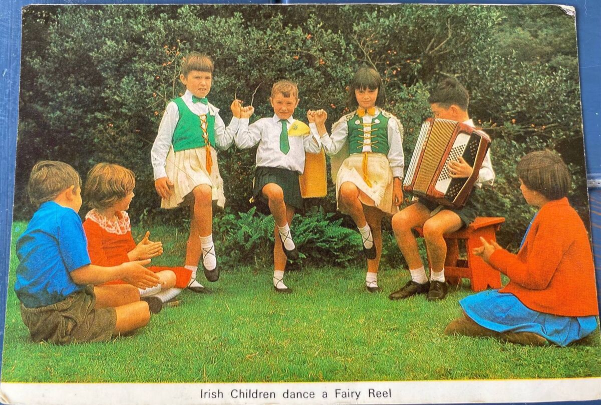 Delia Power as a child in the ‘60s (far right) watching a Fairy Reel dance in a postcard. Sitting on the left are her brother, Finbarr Goggin and Eileen Lynch. The dancers are Ann Keohane , her sister Margarie, Deirdre O’Mahoney, and the boy sat on the stool was called O’Sullivan - all these children went to Bantry school Delia Power as a child in the ‘60s (far right) watching a Fairy Reel dance in a postcard. Sitting on the left are her brother, Finbarr Goggin and Eileen Lynch. The dancers are Ann Keohane , her sister Margarie, Deirdre O’Mahoney, and the boy sat on the stool was called O’Sullivan - all these children went to Bantry school