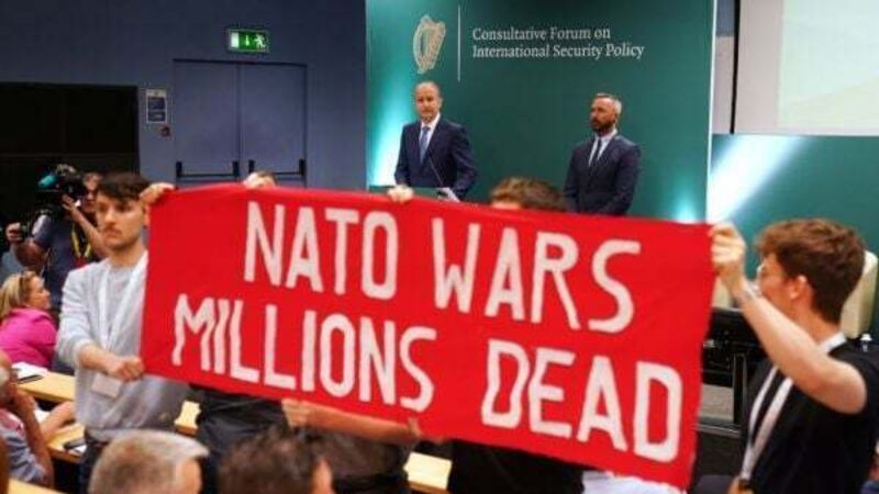 Gardaí remove protesters after Micheál Martin heckled at security policy forum
