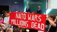 Gardaí remove protesters after Micheál Martin heckled at security policy forum