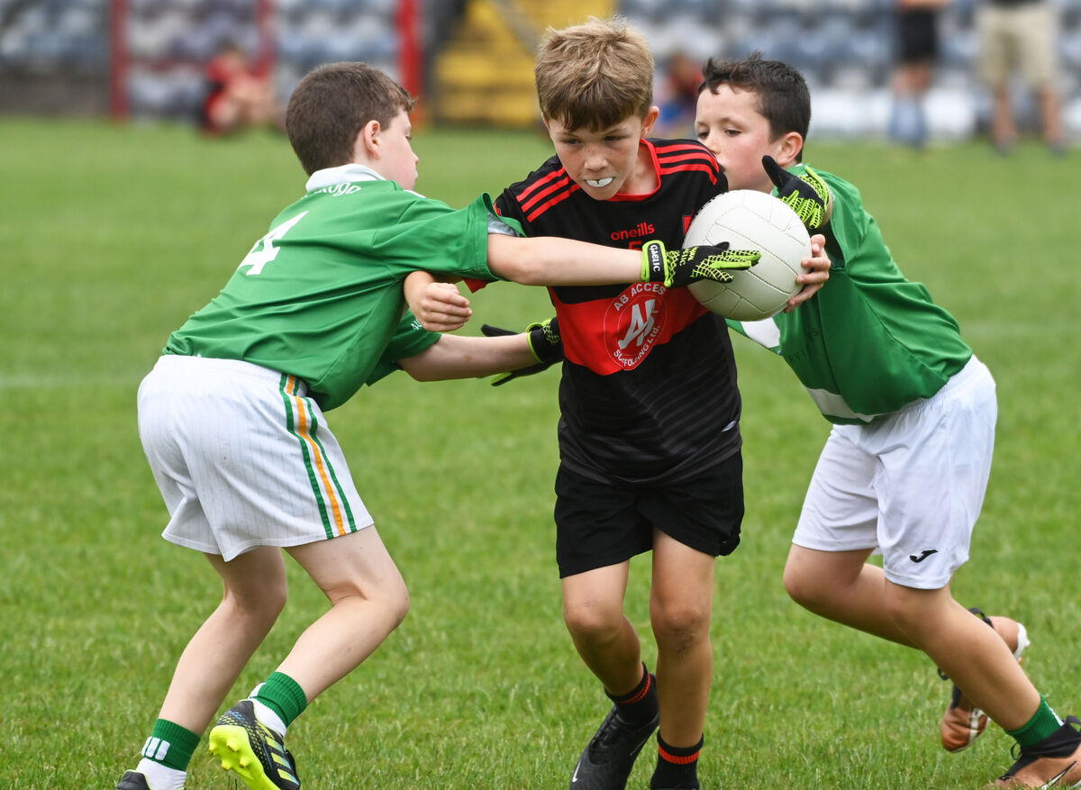 Crosshaven's Mossie Birmingham bursting through against Shamrocks' Ryan Collins. Picture: Eddie O'Hare