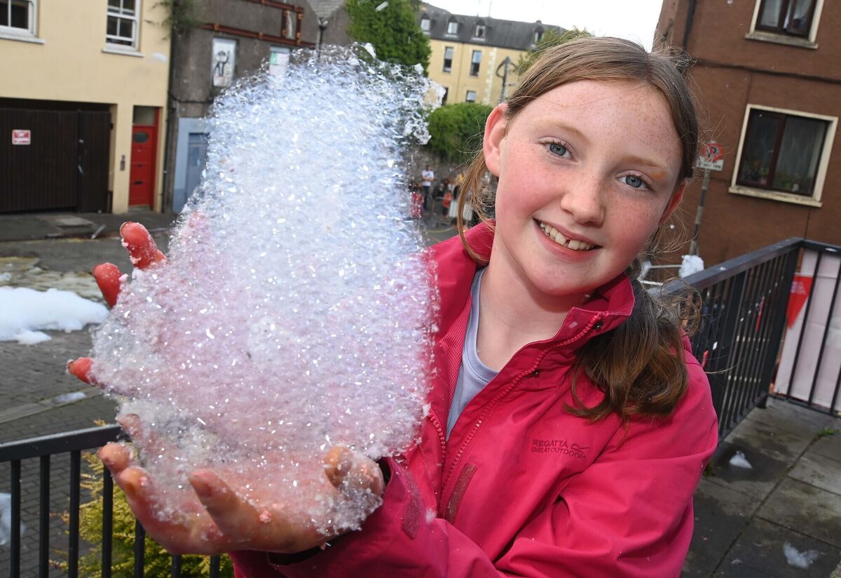 Grace Murphy with a piece of the foam which was floating through the air during the Island of Foam.