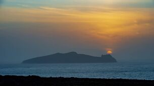 <p>The setting sun over Inis Tuaisceart the northern most of the Blasket Islands known locally as An Fear Marbh or ( The Sleeping Giant ). Picture Dan Linehan</p>