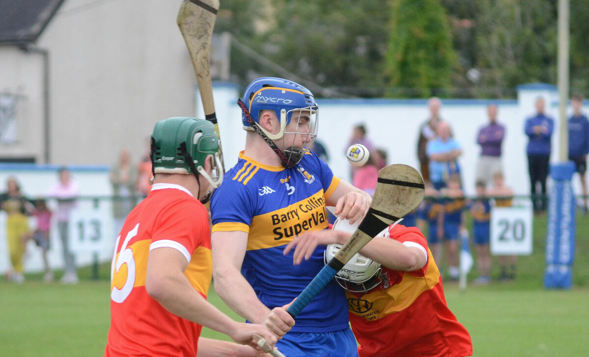 Carrigaline's Stephen Williamson attempts to hold onto the sliothar as Jack Sheehan and Joe Cooper of Éire Óg challenge him in last year's Premier IHC championship. They will renew acquaintances in this year's league Division 3 final. Picture: Howard Crowdy 