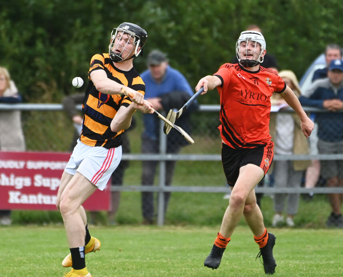 Avondhu's Bill Curtin is tackled by Duhallow's Jason O'Callaghan during the Co-Op Superstores Cork divisional/colleges HC semi final at Dromtarriiffe. Picture; Eddie O'Hare