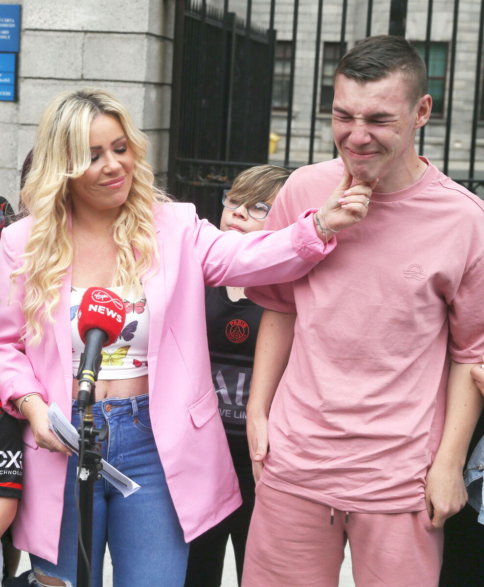 Melissa McCarthy with her emotional son Calum McCarthy (16) outside the High Court in Dublin this afternoon.