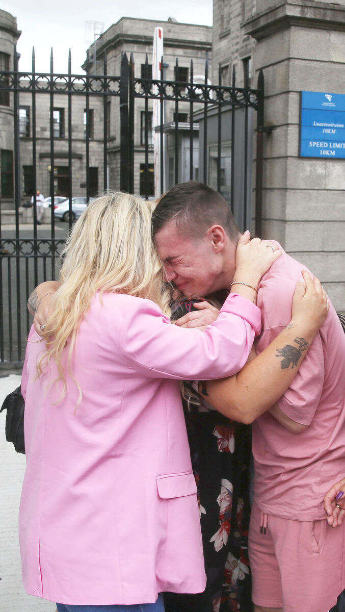 Melissa McCarthy and her son Calum McCarthy (16) embrace outside the High Court in Dublin this afternoon.