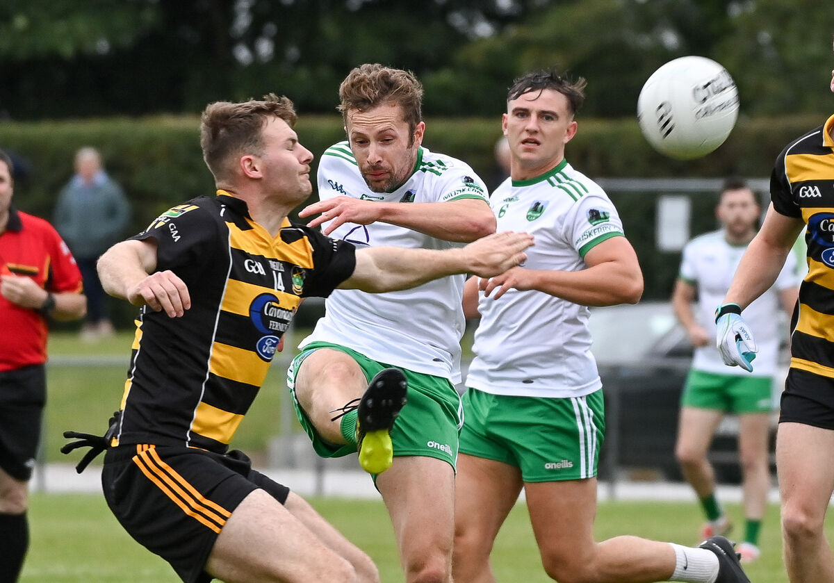  Muskerry's Ian Wycherley shoots under pressure from Avondhu's Padraig Looney, during their Divisional/Colleges SFC semi-final at Glenville.
