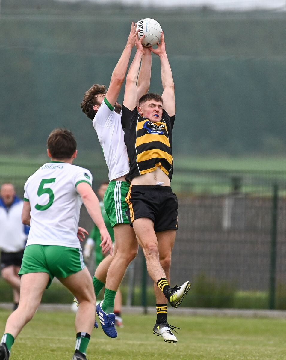  Avondhu's Brian Guerin and Muskerry's Mike Lordan, compete in the air during their Divisional/Colleges SFC semi-final at Glenville.