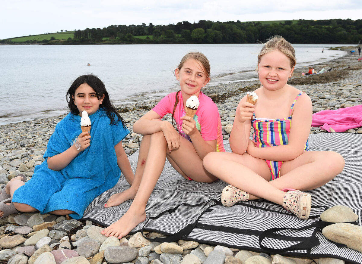 Vicky McLaughlin, Lola Casey-Flodman and Alex Archer from Rochestown enjoying ice cream on the beach in Fountainstown, Co. Cork. Picture; Eddie O'Hare