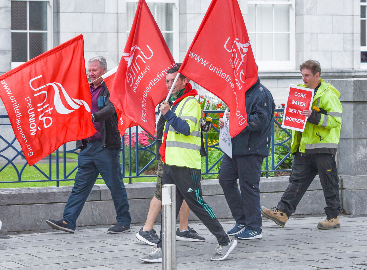 Cork Water Service workers march outside Cork City Hall as part of the Unite protest held on Friday. The strike saw more than 100 Unite members picket throughout the country, as well as a 24 hour withdrawal of services. Picture: Cian O'Regan.