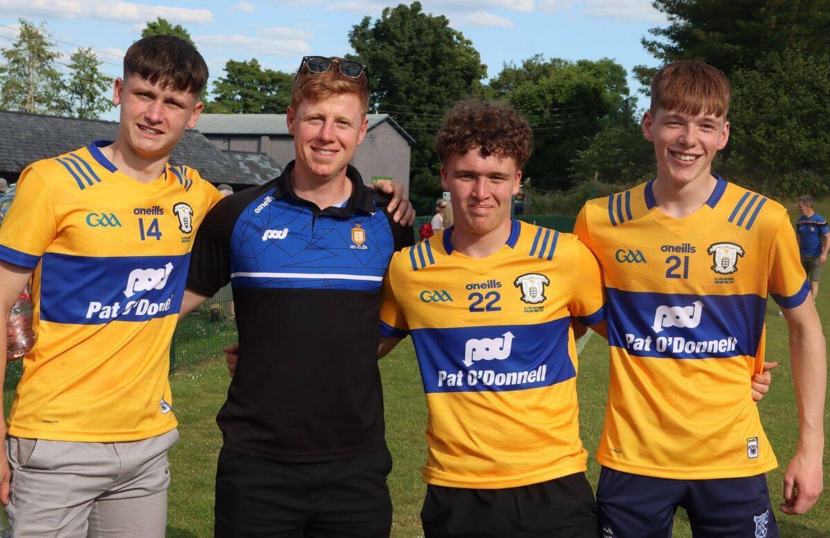 Cork man Hugh O'Neill who served as the strength and conditioning coach with the Clare minor hurling team pictured with three players from their team.