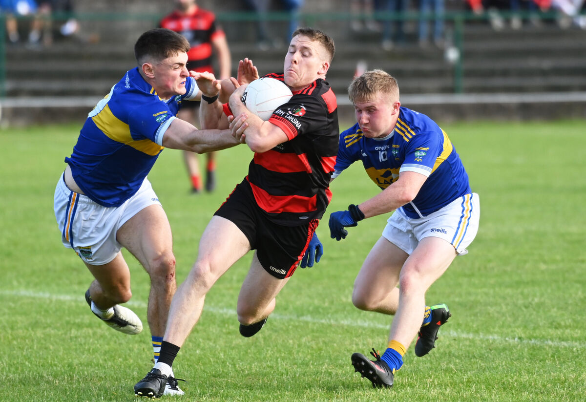 Newmarket's Paudie Allen breaks between Kilshannig's Brian Guerin and Eoin Healy. Picture: Eddie O'Hare