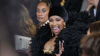 Cardi B and Tracee Ellis Ross sit front row at Schiaparelli show in Paris