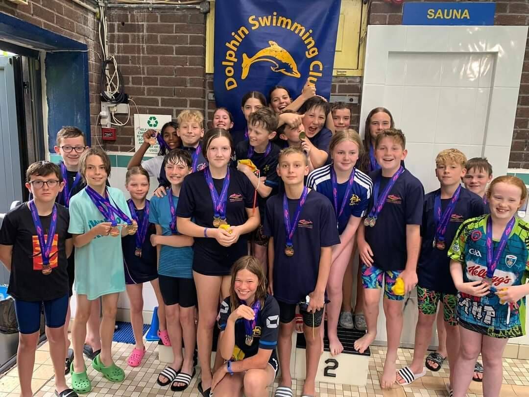 The Dolphin team display their collection of medals after a very successful Dolphin Minnows Gala. The Dolphin team display their collection of medals after a very successful Dolphin Minnows Gala.
