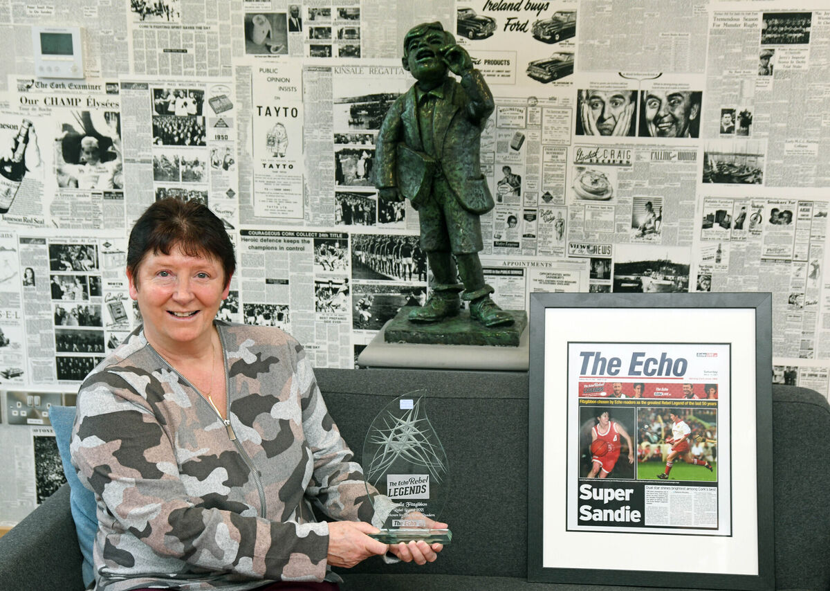 Sandie Fitzgibbon, The Echo Rebel Legends award winner, with the award and a framed front page of The Echo. Picture: Denis Minihane. Sandie Fitzgibbon, The Echo Rebel Legends award winner, with the award and a framed front page of The Echo. Picture: Denis Minihane.