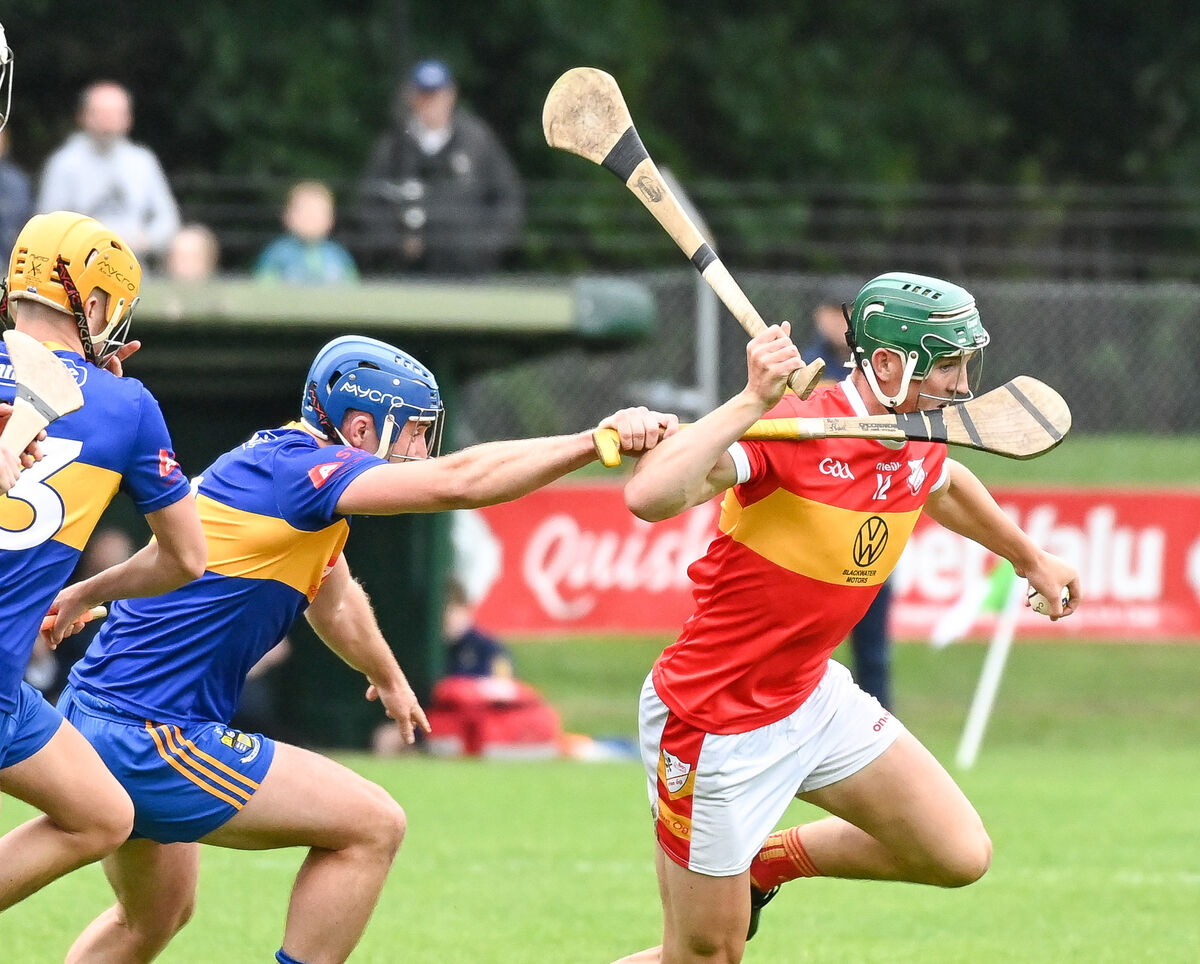 Eire Og's Joe Cooper is tackled by Carrigaline's Rob O'Shea. Picture: David Keane. Eire Og's Joe Cooper is tackled by Carrigaline's Rob O'Shea. Picture: David Keane.
