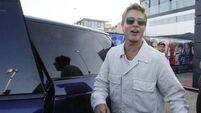 Brad Pitt cheers fans at Silverstone paddock ahead of British Grand Prix