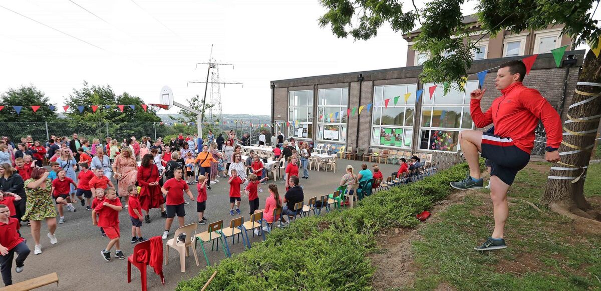 Rugby player Gerry Hurley leads the music exercises during the celebrations. Rugby player Gerry Hurley leads the music exercises during the celebrations.