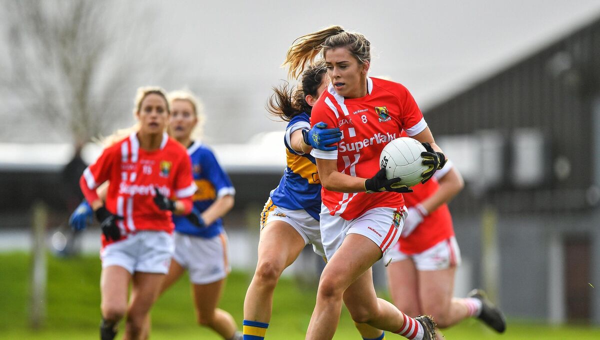Maire O'Callaghan is tackled by Roisin Daly of Tipperary.
