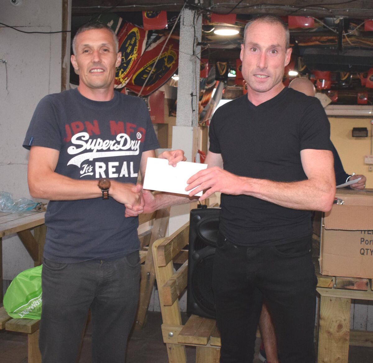 Brian Harty of sponsor Harty Tax Consulting presenting his brother Michael with the prize at the Cloyne 5km. Picture: John Walshe Brian Harty of sponsor Harty Tax Consulting presenting his brother Michael with the prize at the Cloyne 5km. Picture: John Walshe
