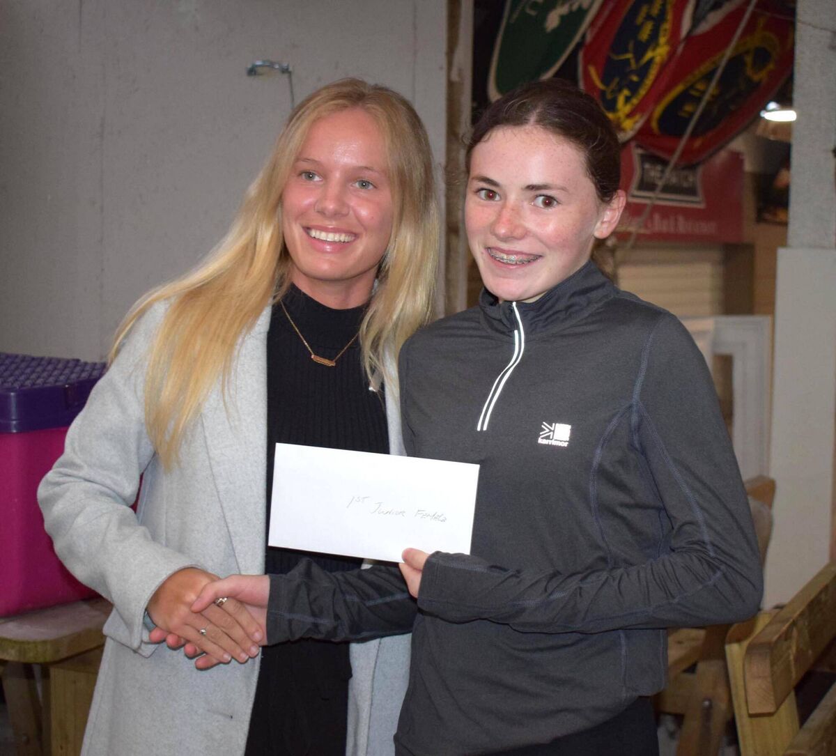 Katie Hennessy of Midleton AC, first in the junior race at Cloyne, receiving her prize from sponsor Kerrie Keane of The Porter House. Picture: John Walshe Katie Hennessy of Midleton AC, first in the junior race at Cloyne, receiving her prize from sponsor Kerrie Keane of The Porter House. Picture: John Walshe