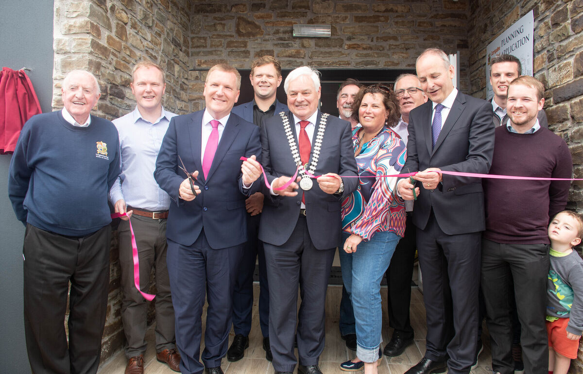 Minister of Finance Michael McGrath TD along with Frank O'Flynn, Mayor Cork County and Tainiste Michael Martin TD cut the tape to officially open the new Carrigaline Mens Shed building watched by local coiuncillors and Barry Cogan, Chairman Carrigaline Mens Shed. Picture: Howard Crowdy Minister of Finance Michael McGrath TD along with Frank O'Flynn, Mayor Cork County and Tainiste Michael Martin TD cut the tape to officially open the new Carrigaline Mens Shed building watched by local coiuncillors and Barry Cogan, Chairman Carrigaline Mens Shed. Picture: Howard Crowdy