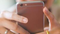 close up young beautiful asian woman looking at  smartphone for video online chat with friends   or surf the internet or playing