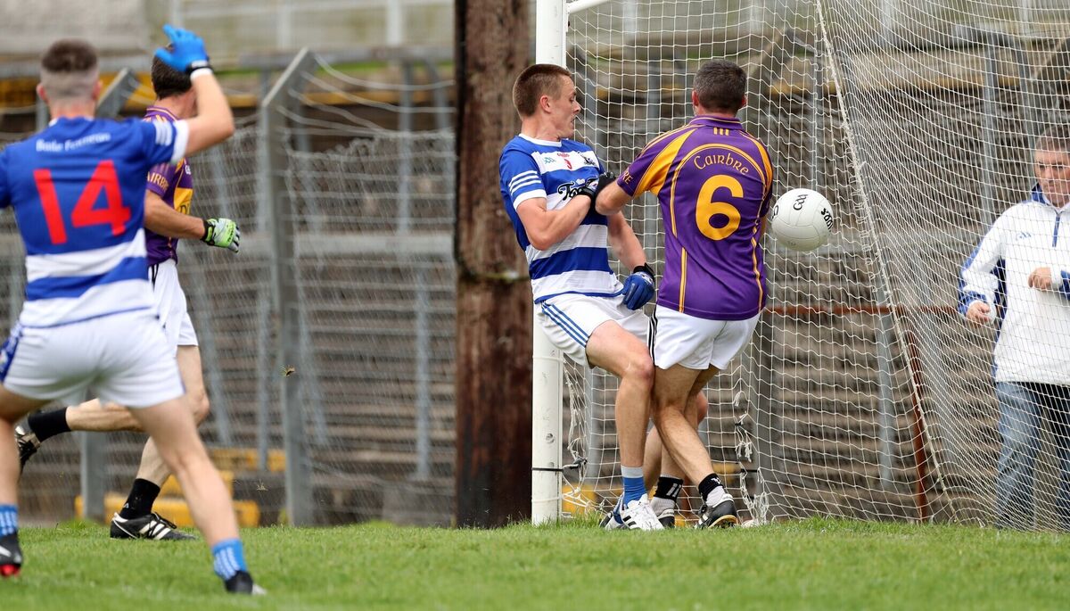  Cian O'Brien, Ballyphehane, scores a goal under pressure from Gary McCarthy, St Oliver Plunkett's. Picture: Jim Coughlan