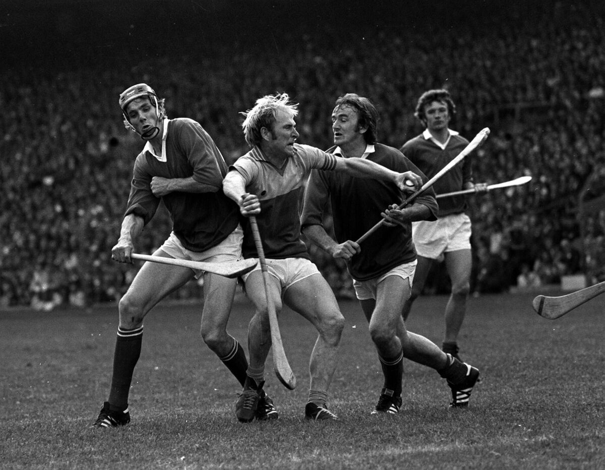 Cork brothers Ray and Brendan Cummins challenge Wexford's Willie Murphy in the 1976 All-Ireland final. 