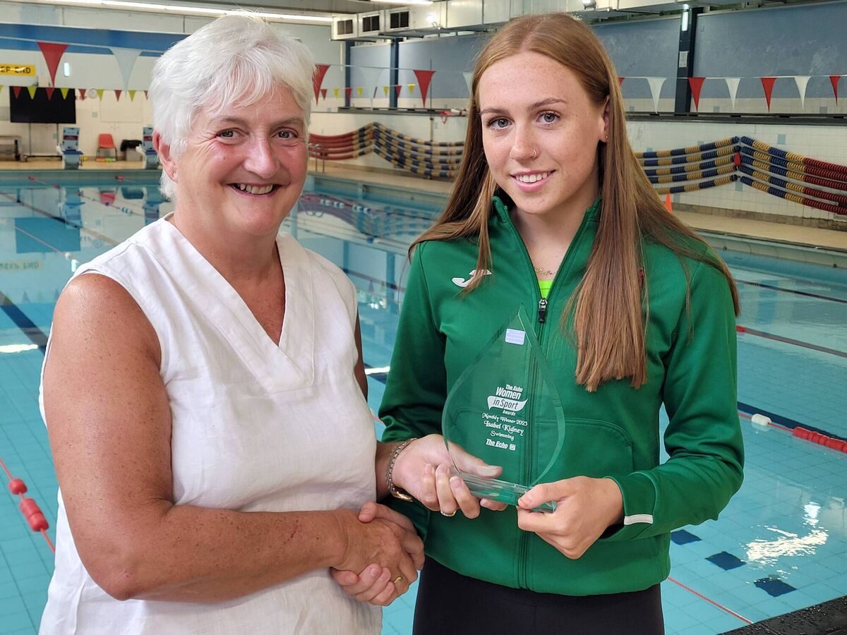 Isabel Kidney, SWSC, receiving the Echo Women in Sport Award for June, from Swimming Correspondent, Mary Haughney.
