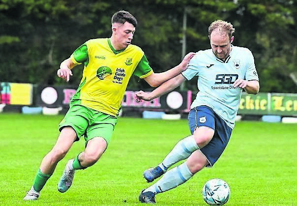  Avondale United’s David O’Leary swerves past Rockmount’s Bradley Walsh in their league game last season. O’Leary remains a key part of the Avondale set-up.  	Picture: David Keane
                    