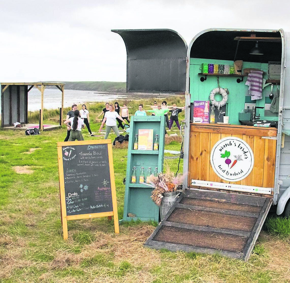 Niamh’s Larder food stop on Ballybrannigan Beach in East Cork, with a yoga class in the background. Picture: Richard Gordon. Niamh’s Larder food stop on Ballybrannigan Beach in East Cork, with a yoga class in the background. Picture: Richard Gordon.