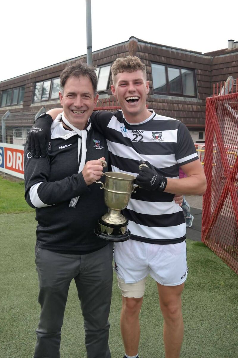 St Oliver Plunkett's captain Ronan McCarthy pictured with club vice chairman Michael Donegan. St Oliver Plunkett's captain Ronan McCarthy pictured with club vice chairman Michael Donegan.
