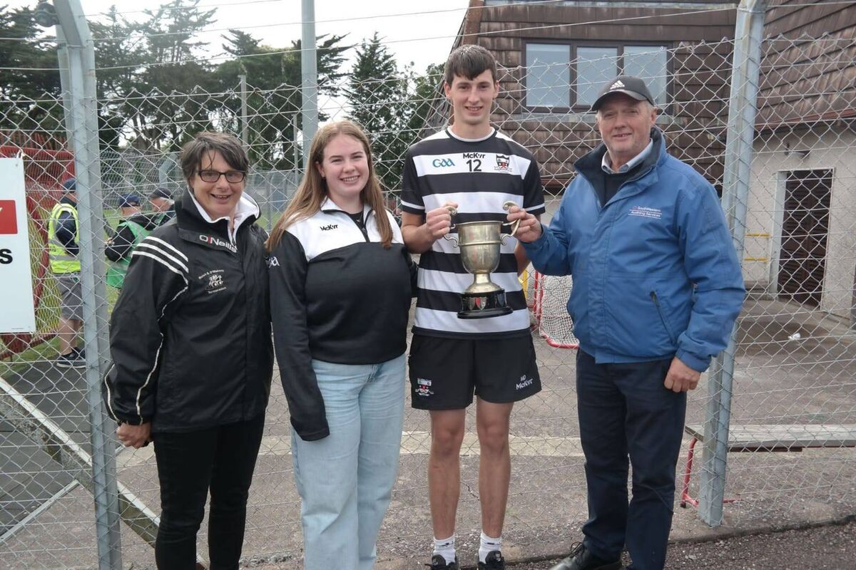 St Oliver Plunkett's player Ciaran Dullea pictured with his family after the football final. St Oliver Plunkett's player Ciaran Dullea pictured with his family after the football final.