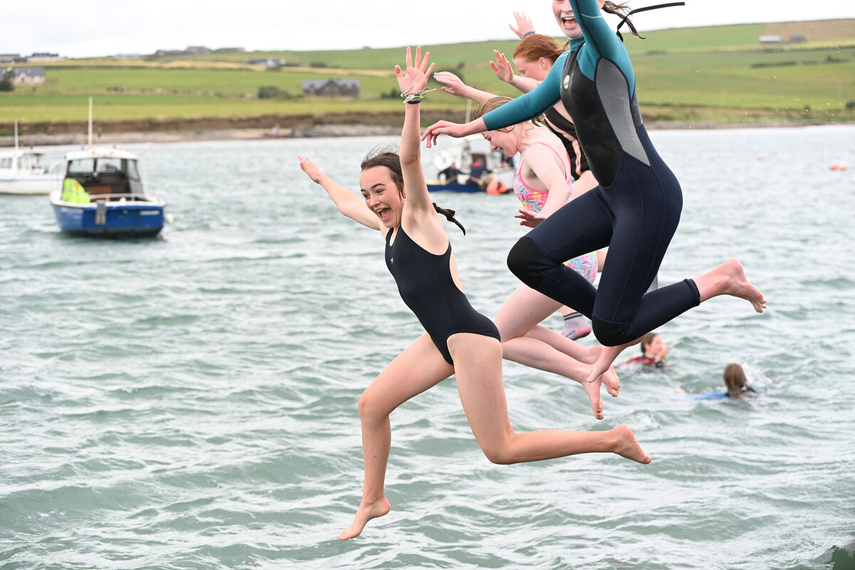 Caoimhe Browne and friends jump off the pier after they completed their water safety course. Pic Larry Cummins Caoimhe Browne and friends jump off the pier after they completed their water safety course. Pic Larry Cummins