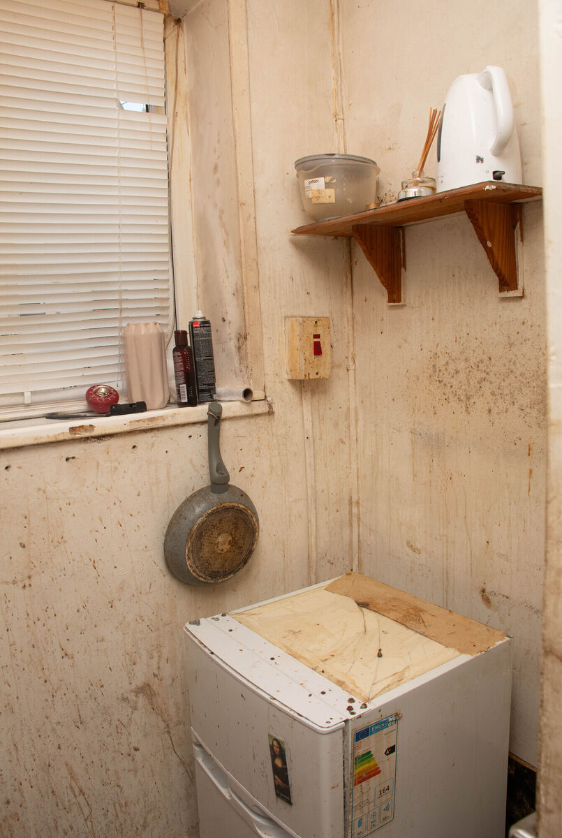 A kitchen area badly affected by dampness in one of the houses along Noonan Road. Picture: Howard Crowdy