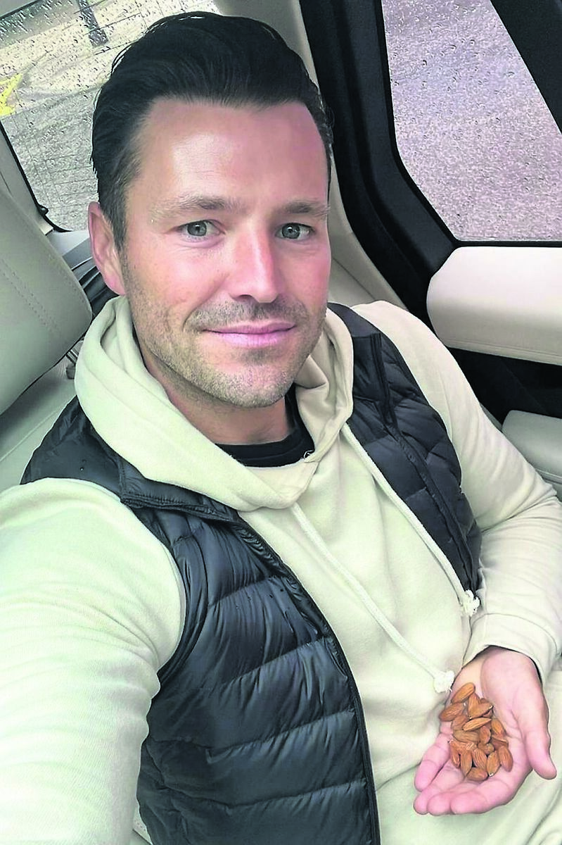 HEALTH-CONSCIOUS: Mark Wright with a handful of almonds HEALTH-CONSCIOUS: Mark Wright with a handful of almonds