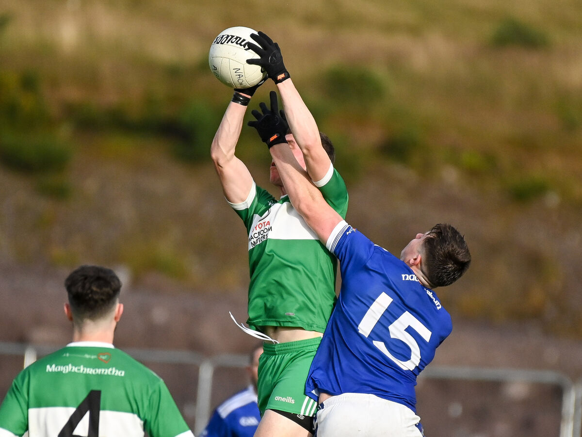  Macroom's Rory Buckley wins possession under pressure from Naomh Aban's Aodhan O Luasa. Picture: David Keane.
