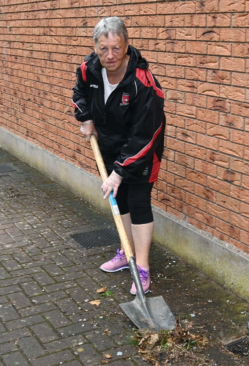 Mary Barrett taking part in Mayfield GAA Club’s community clean-up.
