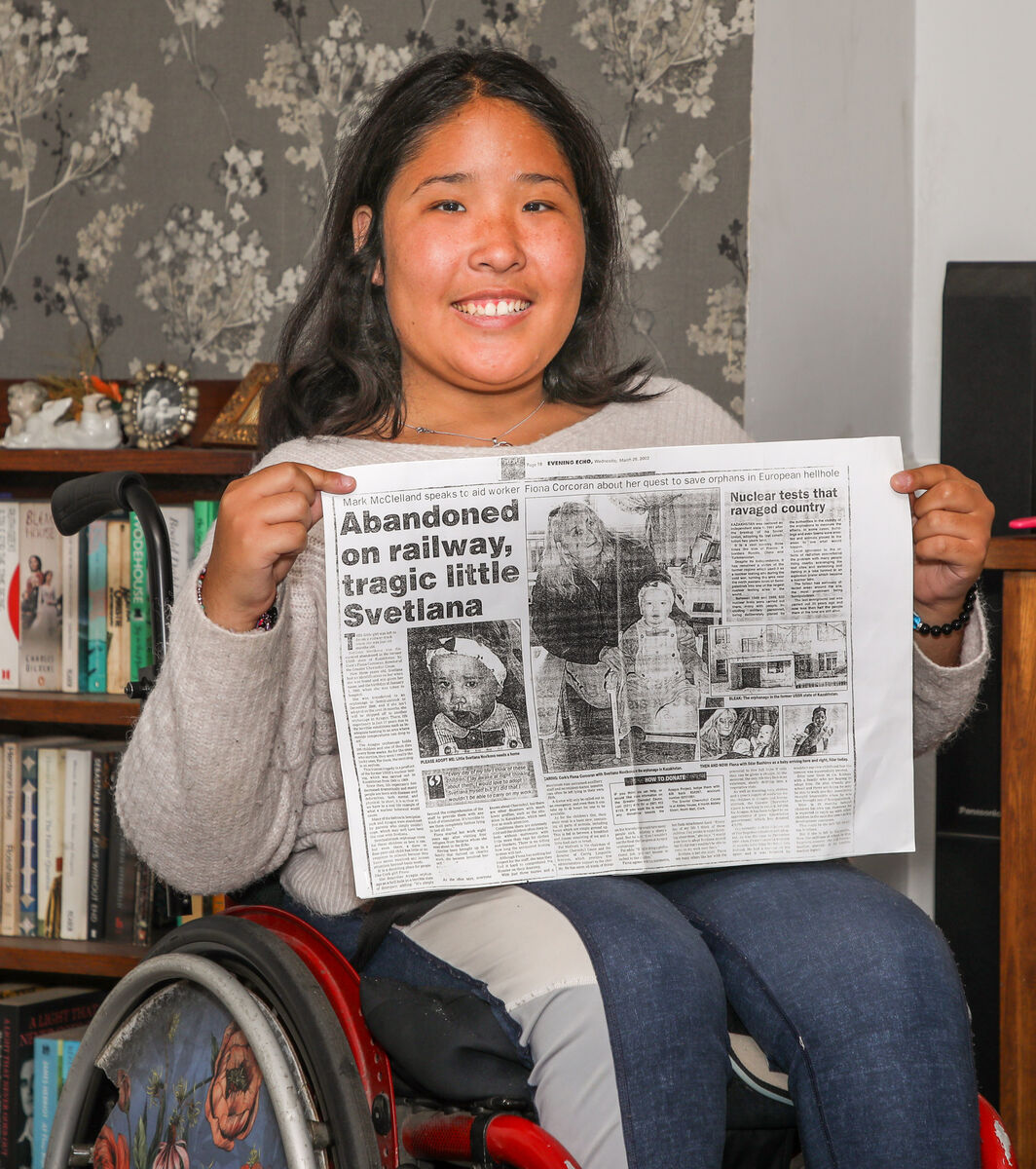 Aimee Kenneally at home in Kinsale, Co. Cork with the article that triggered her adoption from Kazakhatan by the Kenneally family in February 2004. - Picture: David Creedon Aimee Kenneally at home in Kinsale, Co. Cork with the article that triggered her adoption from Kazakhatan by the Kenneally family in February 2004. - Picture: David Creedon