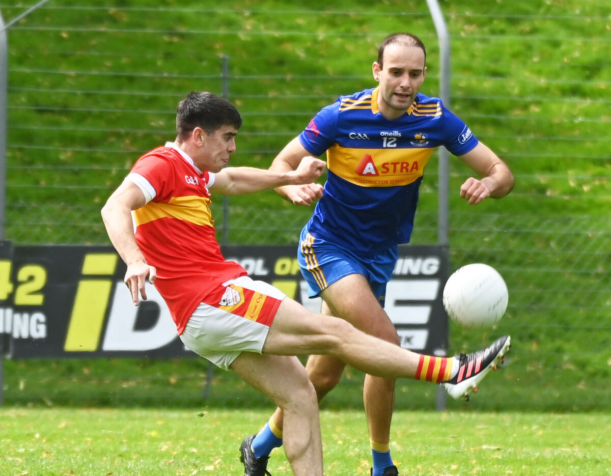 Éire Óg's Eoin O'Shea shoots from Carrigaline's Evan Ryle. Picture: Eddie O'Hare Éire Óg's Eoin O'Shea shoots from Carrigaline's Evan Ryle. Picture: Eddie O'Hare