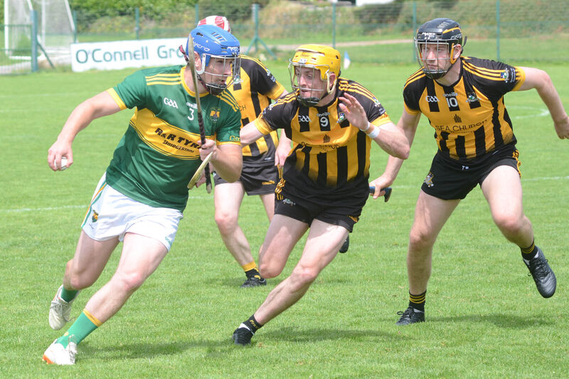 Cloughduv's Aodh Twomey attempts to break away from Luke Duggan and Dan Ruddy of Russell Rovers in the RedFM Hurling League Division 5 final in Caherlag. Picture: Howard Crowdy