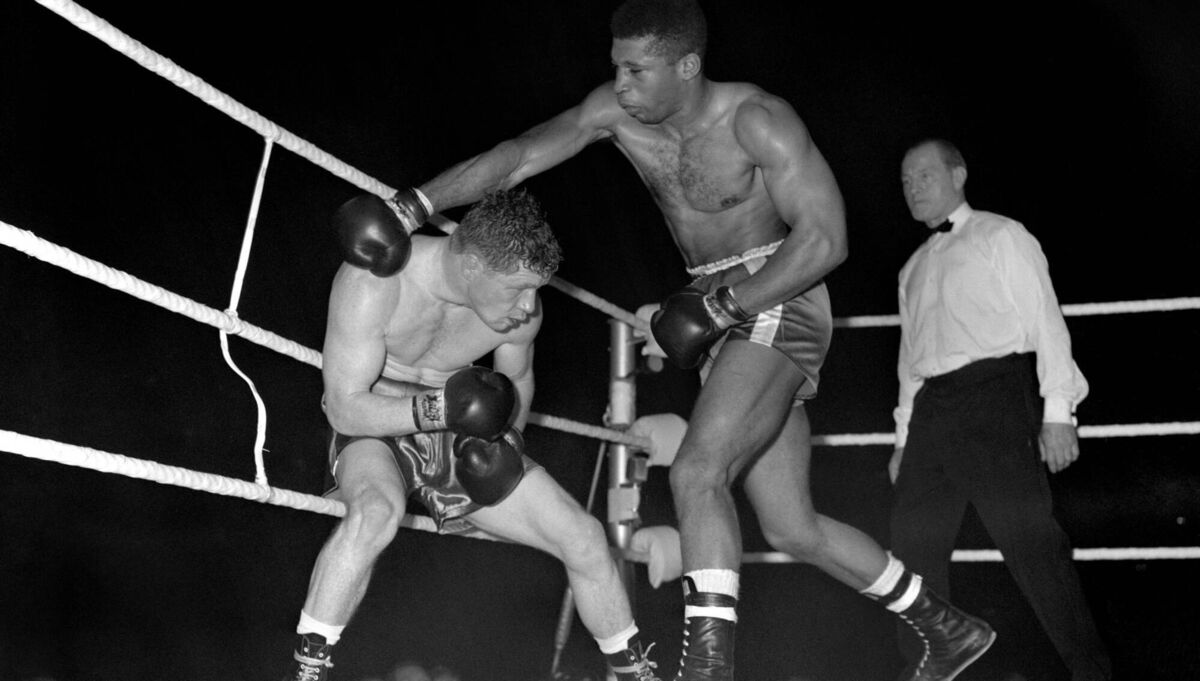 Mick Leahy (l) ducks a shot from Ted Wright during their Welterweight fight at Wembley Arena. The fight ended in a draw.