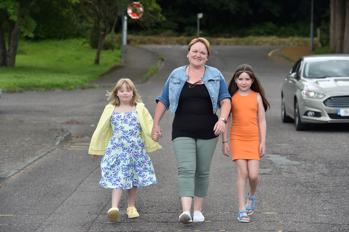 The family walking hand in hand.