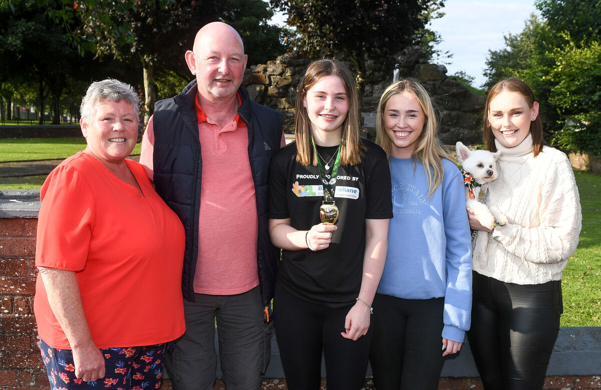 Local hero Aideen Mullins with her parents John and Cynthia and sisters Kayleigh and Evelyn along with family pet Connie, at her homecoming victory parade in Ballyphehane after she won the WBC MuayThai world championship gold medal in Venice. 