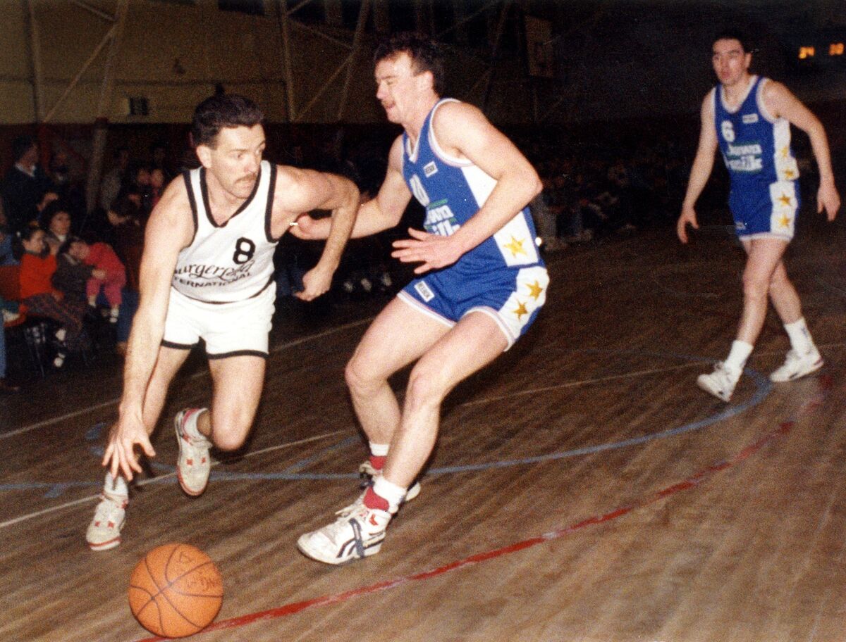 Tom Wilkinson of Neptune goes past Peter O'Sullivan of Blue Demons in 1990 at Parochial Hall. Tom Wilkinson of Neptune goes past Peter O'Sullivan of Blue Demons in 1990 at Parochial Hall.